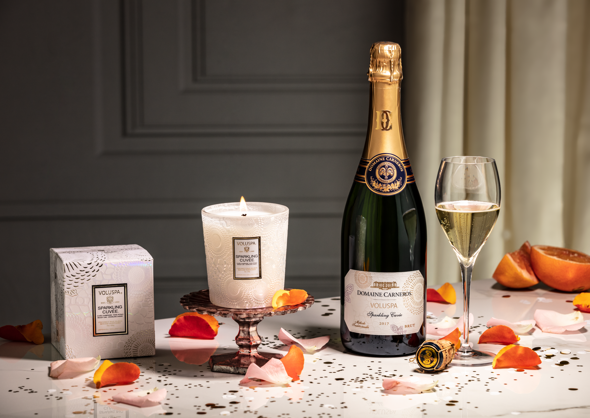 Voluspa and Domaine Carneros by Taittinger welcome the holiday season with the Sparkling Cuvée Candle and Sparkling Wine duo